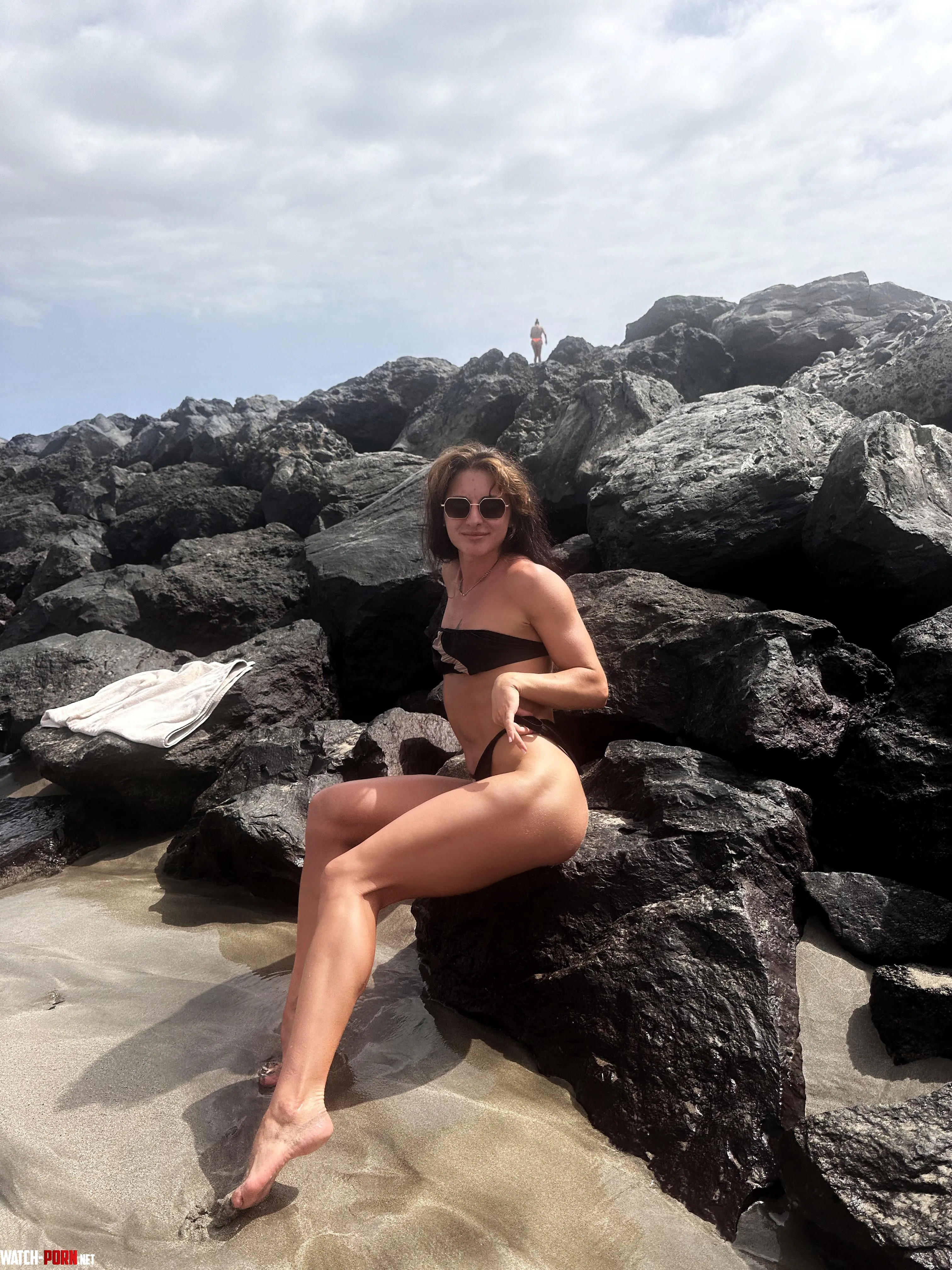 My legs are on the stone beach by kissedkiki