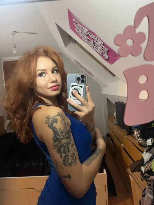 Thumbnail RedheadRosesThornz Flaunts in a Revealing Dress
