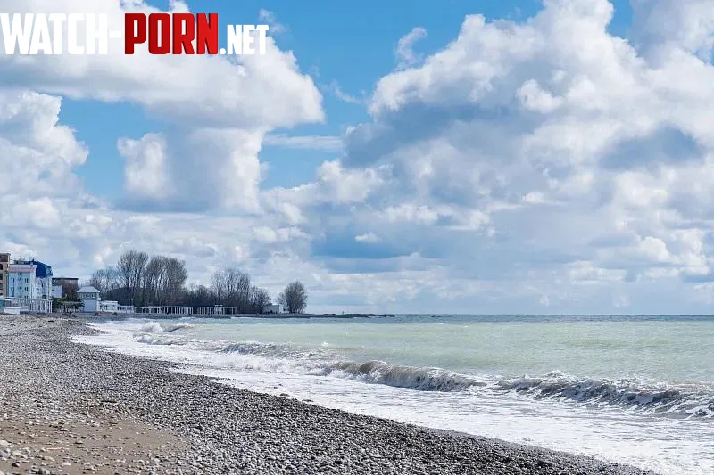 Pebble beach and clouds over the sea by Snoo-95009