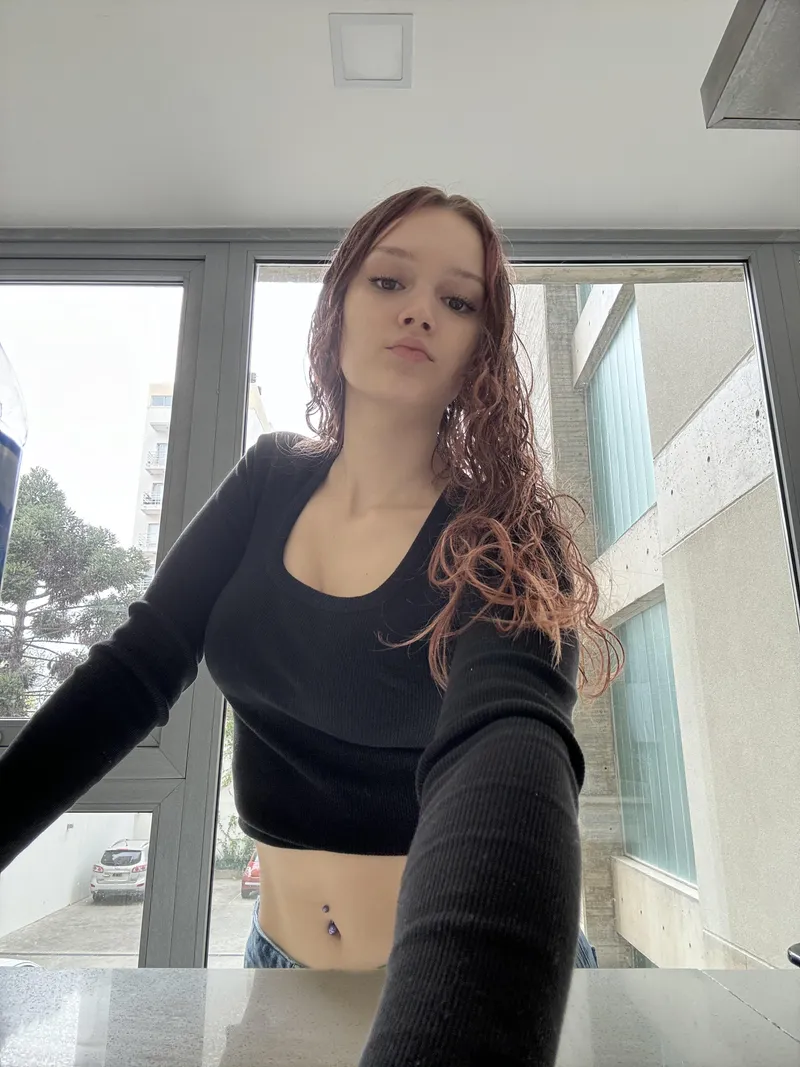 Thumbnail Acrobatic_Smell61's Intriguing Mix of Black Top, Red Hair, and Mischief