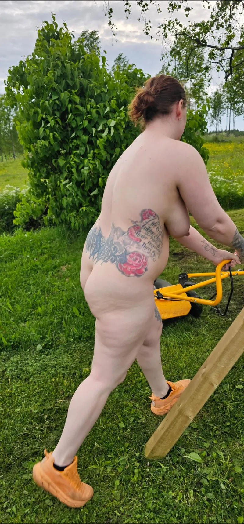 Thumbnail Nudist Mom Cutting Grass Freely by RealNorwegianMom