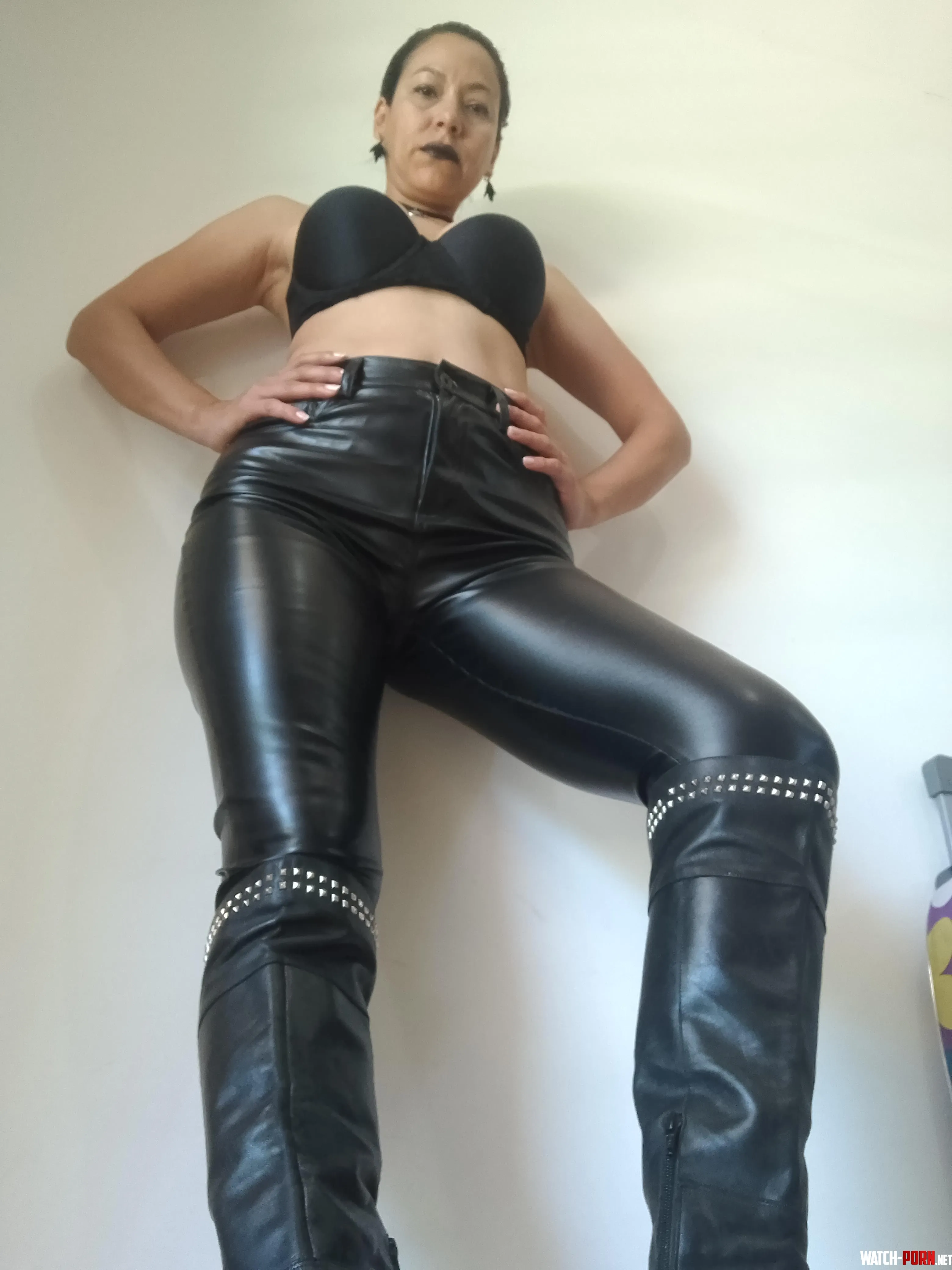 Leather, polished boots. Steady gaze. Absolute control. If you understand what they mean… you already belong beneath them. by GoodnessCindy