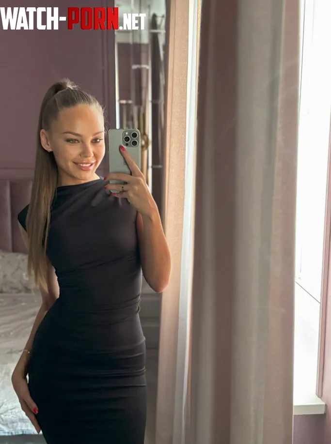 Silky gown showcasing feminine grace by Tavrenn