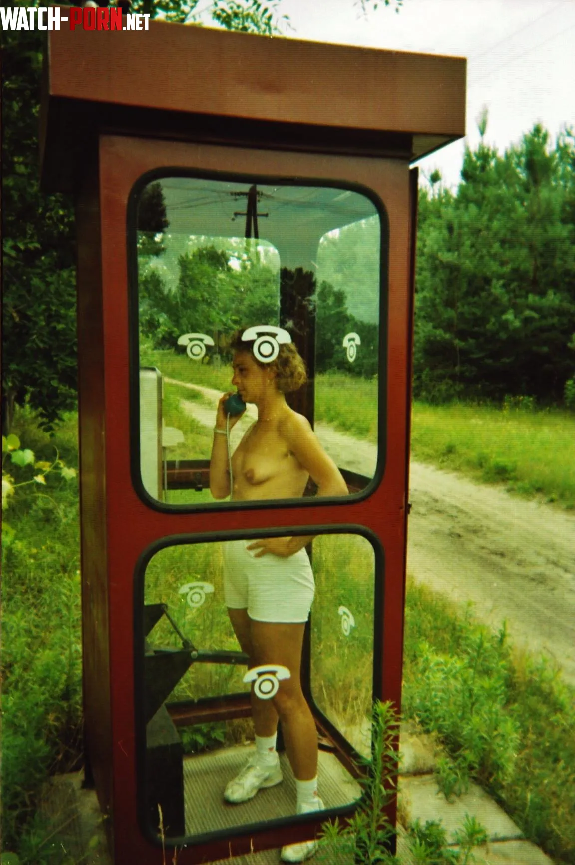 Topless in the telephone box by mazopheliac