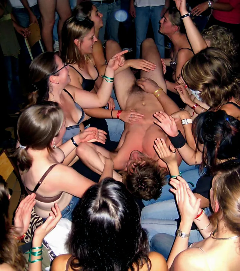 Thumbnail Male college student being hazed is reluctant to show his cock to the female students surrounding him
