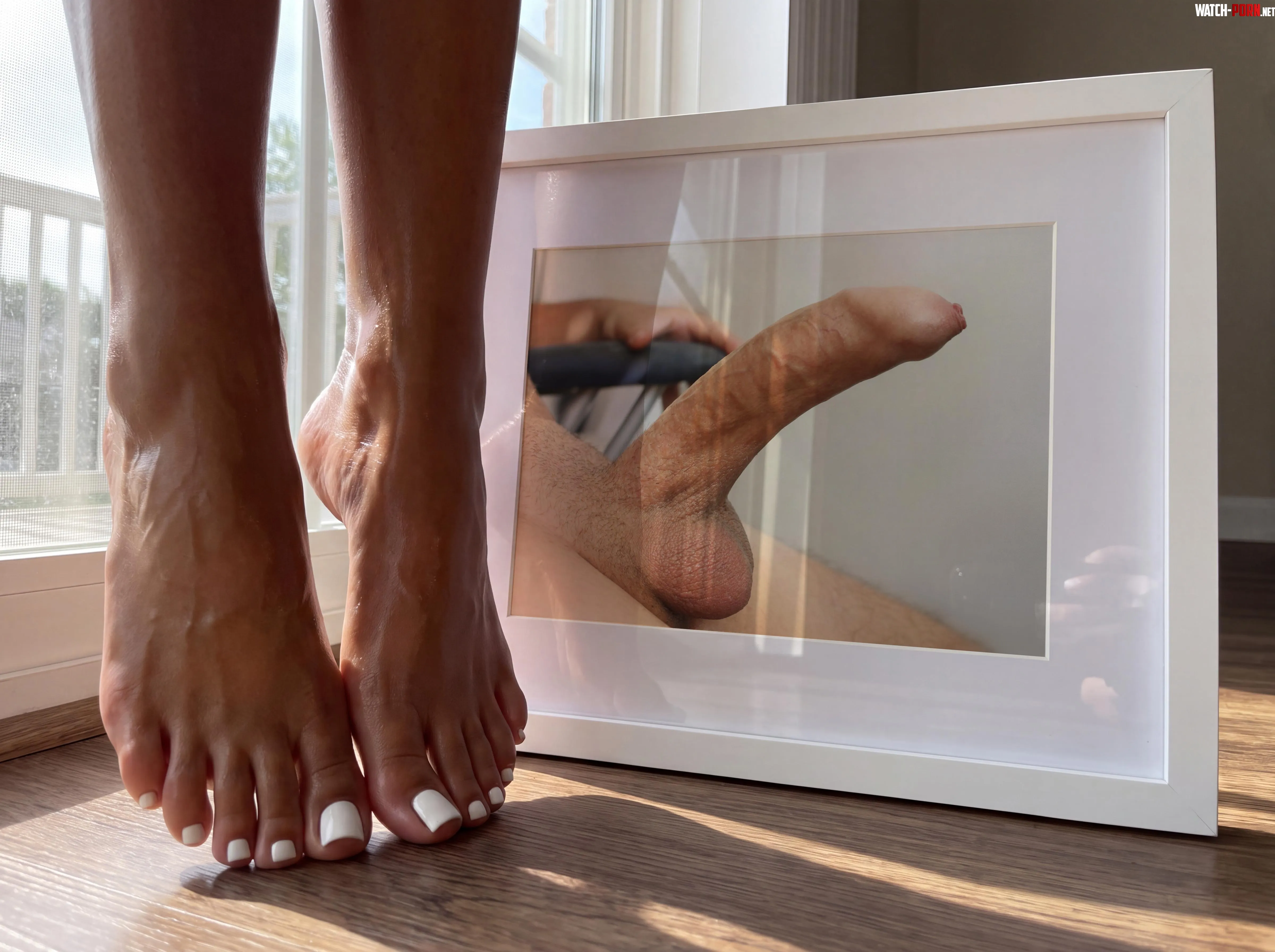 Appreciating a portrait I shot of hubby with my feet! [oc]😍📸 by Acortez92