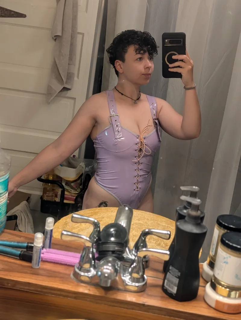 Thumbnail This short haired baddie got a new purple PVC one piece