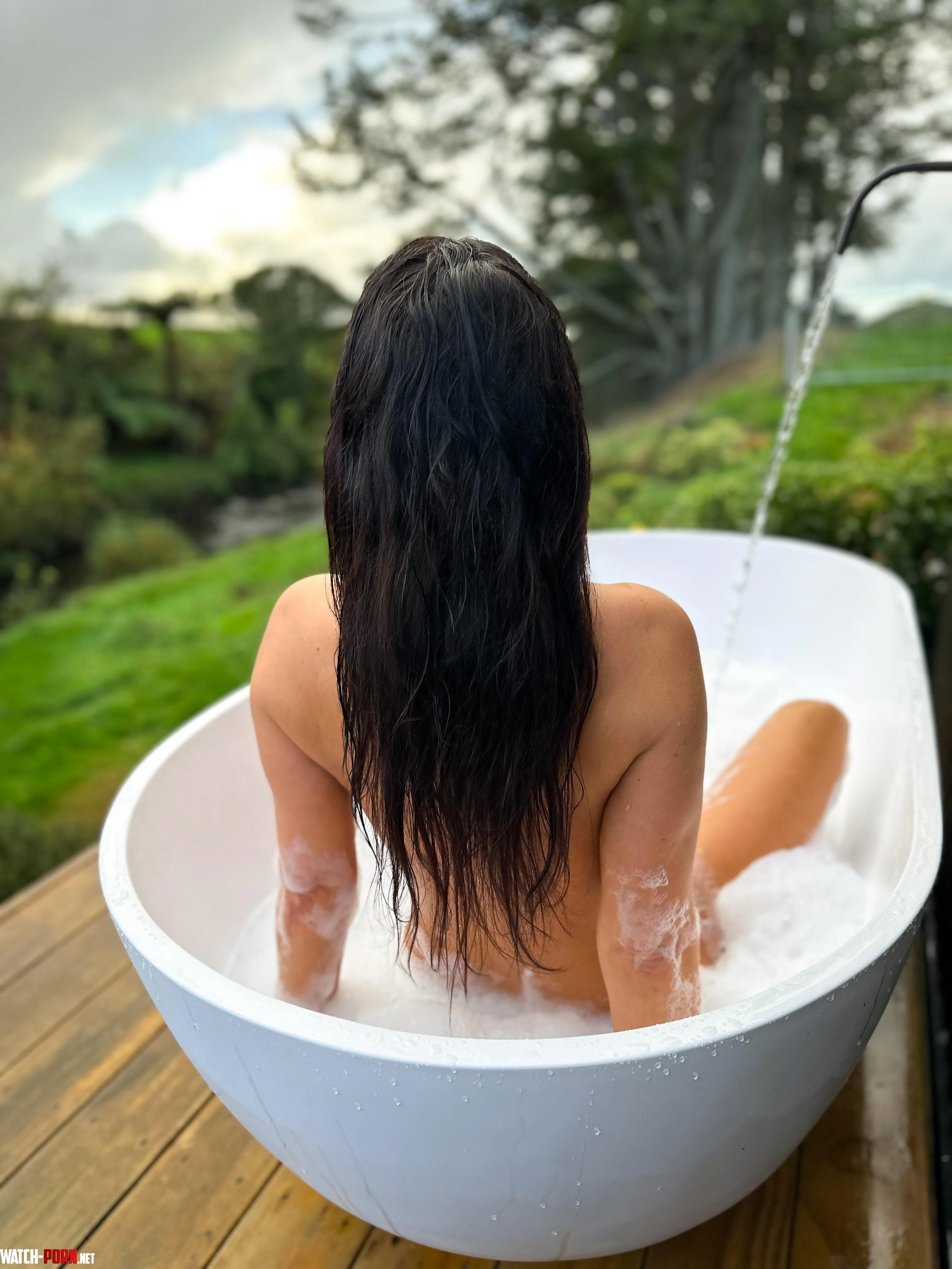 Nothing better than an outdoor bath with this view 🌿🛁 Would you stay in until the water went cold… by breasts-in-nature