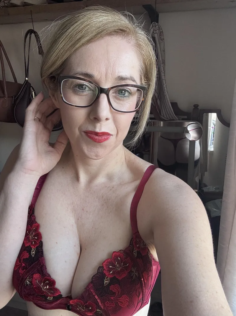 Thumbnail The red lace bra keeps it all a mystery...
